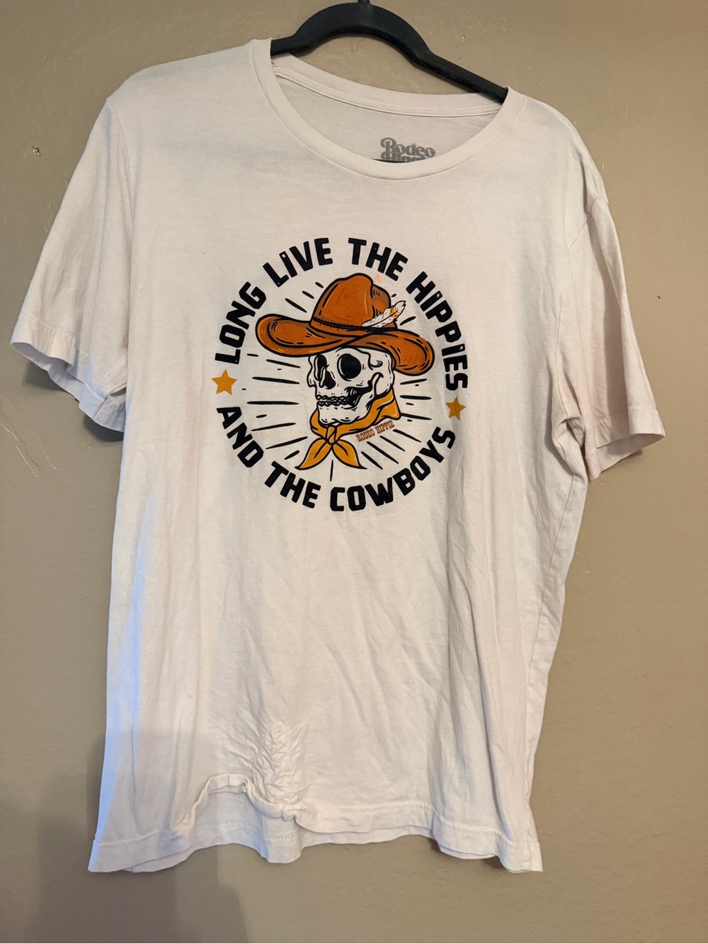 White Graphic Women’s Tee with Orange Cowboy Skull -